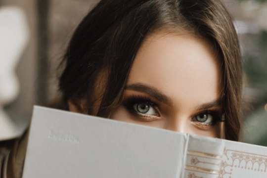 charming-girl-closed-book-her-face